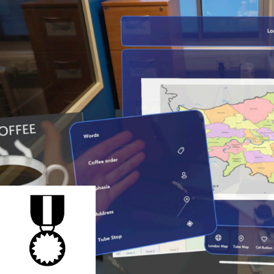 Person in an AR environment with objects projected into the scene -- a cofee is shown as well as other interface elements.